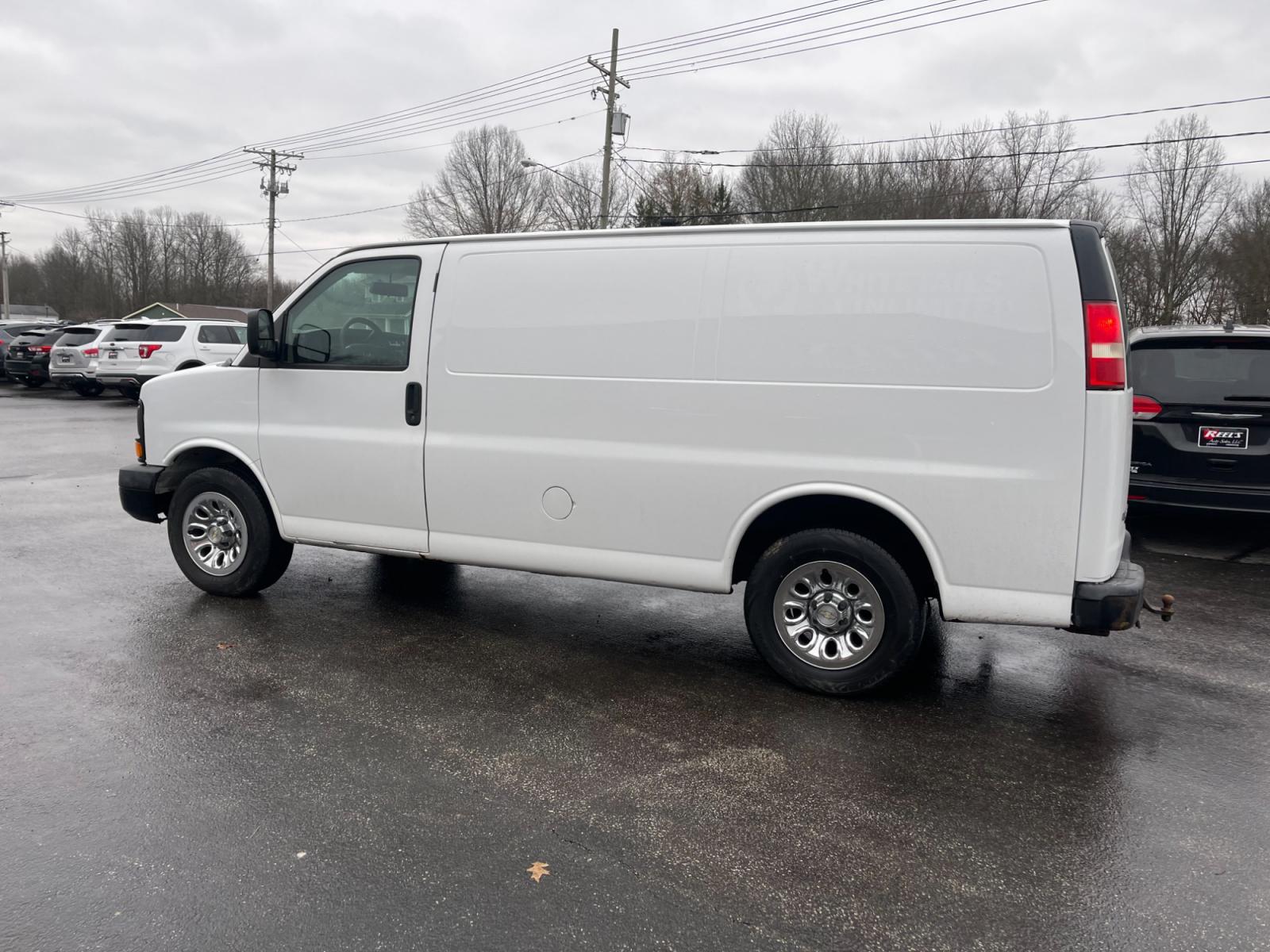 2014 White /Neutral Chevrolet Express 1500 AWD Cargo (1GCSHAF4XE1) with an 5.3L V8 OHV 16V FFV engine, 4-Speed Automatic transmission, located at 547 E. Main St., Orwell, OH, 44076, (440) 437-5893, 41.535435, -80.847855 - This 2014 Chevrolet Express 1500 Cargo Van with a 5.3L Vortec V8 engine and all-wheel drive is a versatile and robust vehicle designed to meet various transportation and towing needs. It comes equipped with convenient features such as power windows, power locks, and a backup camera for safer reversi - Photo #11